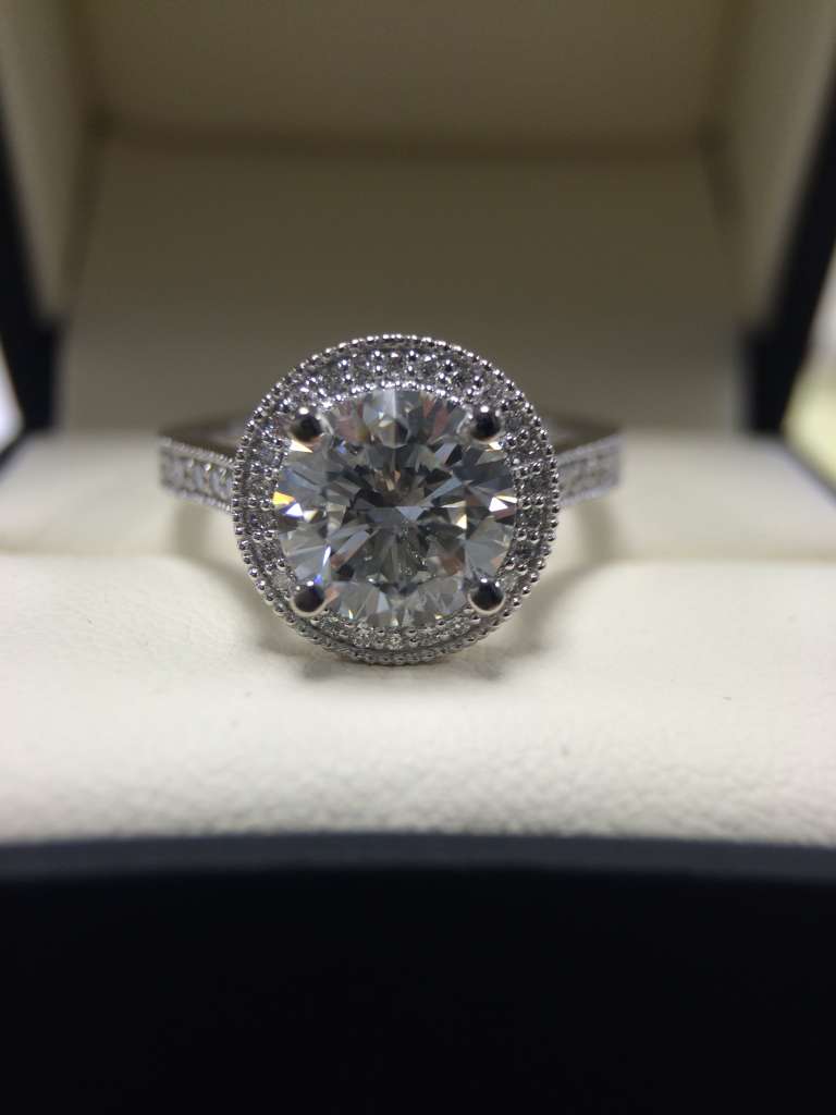 round diamond halo engagement ring with milgrain