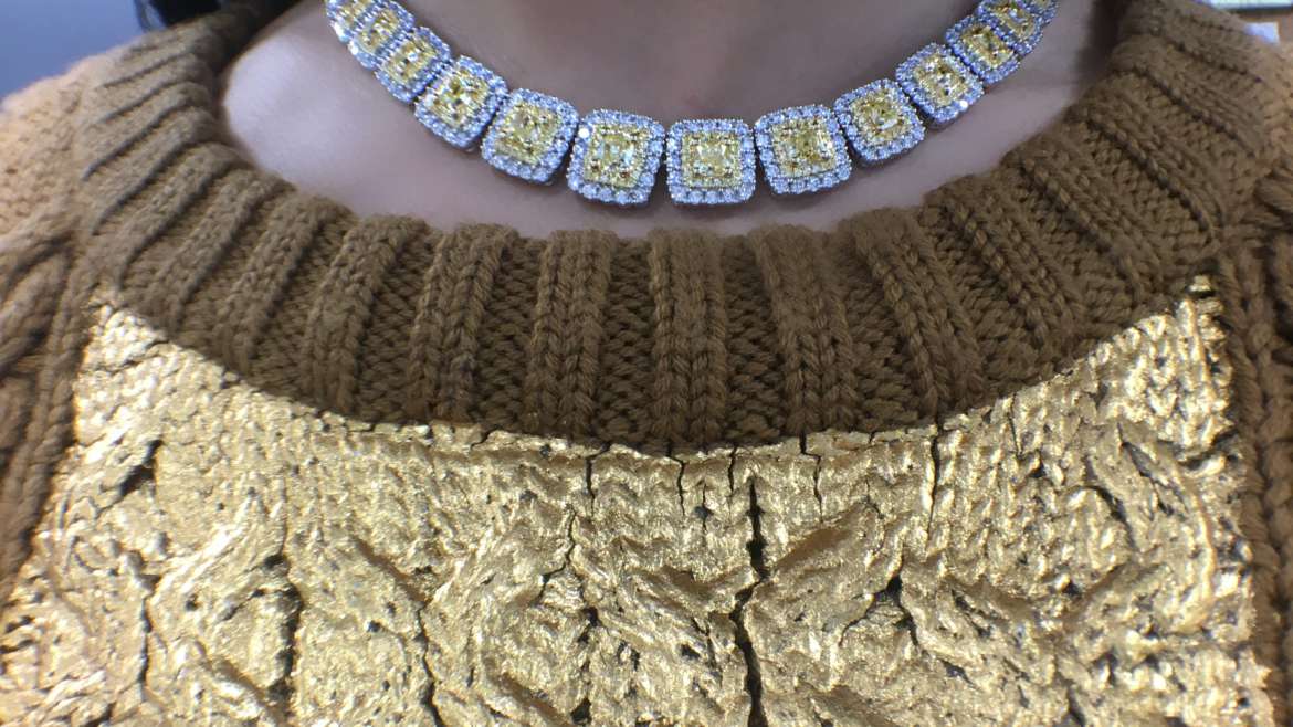 Fancy yellow diamond halo neckalce